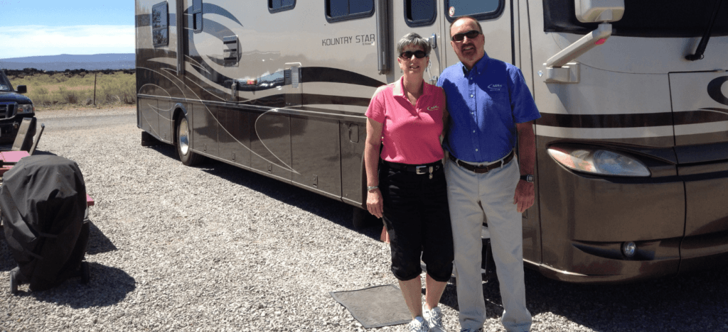 Larry-Nancy-by-their-motorhome-1024x468.png