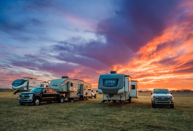 RVs parked under an Arizona desert sunset
