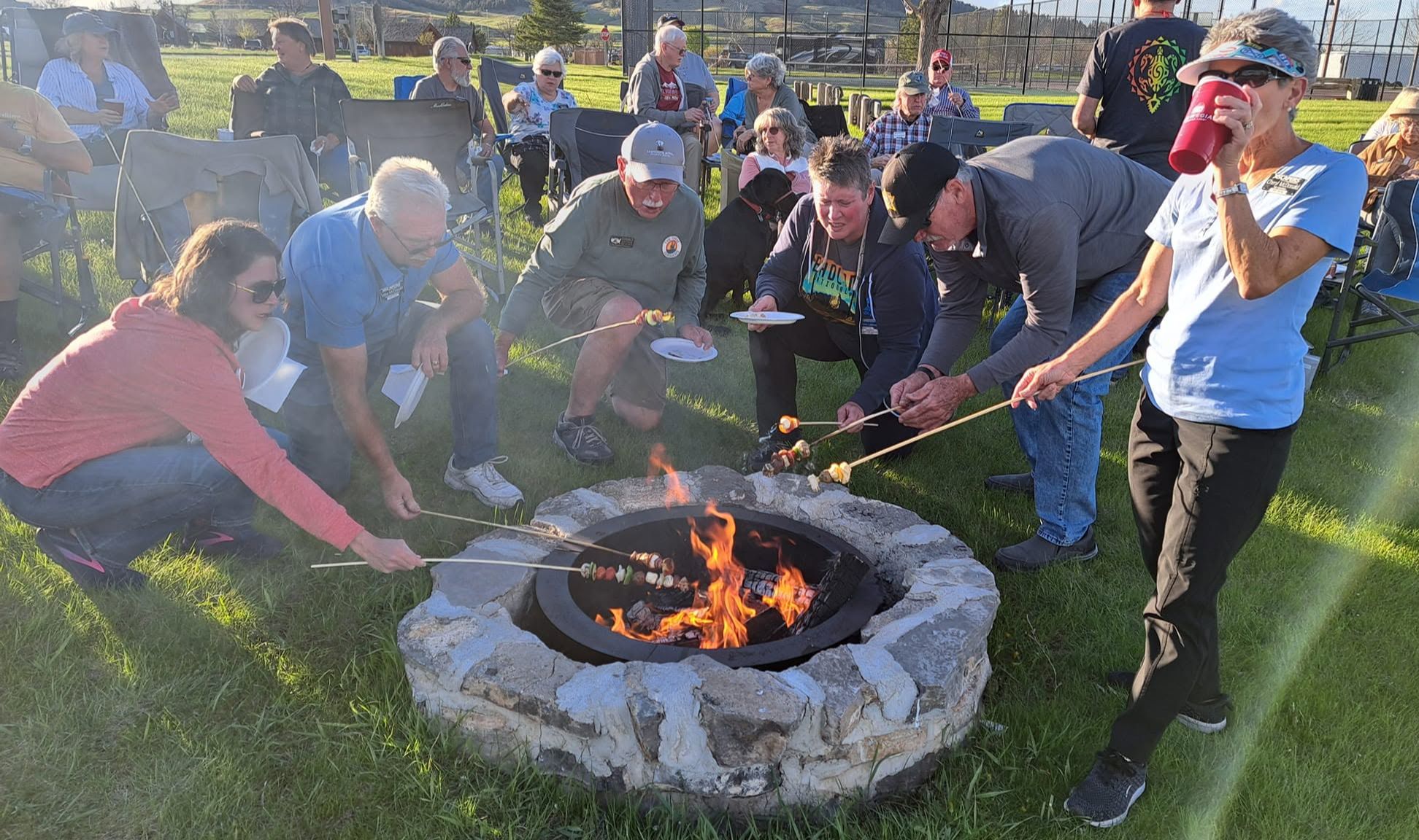 RVers gathered around a campfire