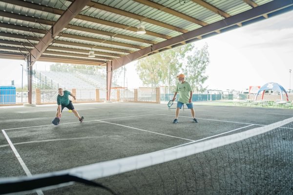 Escapade attendees playing pickleball